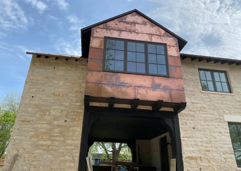 Copper metal panel facade on a stone building for Skylight Installation in Des Plaines