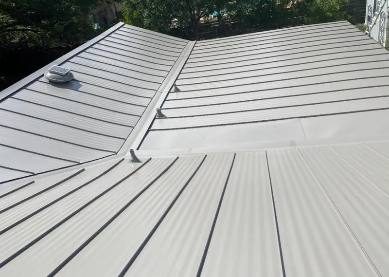Solar attic fan installed on a metal roof for Roof Ventilation in Des Plaines